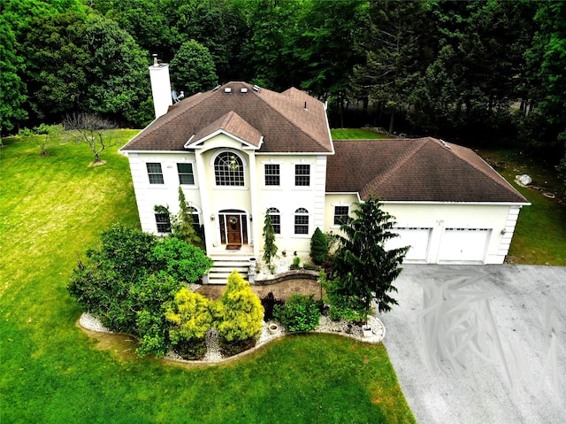 344 Ingrassia Rd, Middletown, NY 10940 - view of front of house with a chimney, a garage, a front yard, and roof with shingles