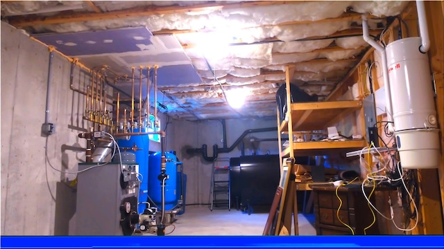 344 Ingrassia Rd, Middletown, NY 10940 - unfinished basement with a central vacuum unit and a water pressure tank