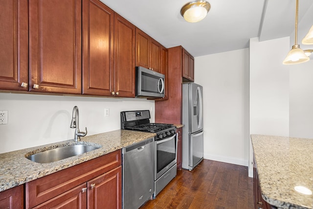 880 Boynton Ave Unit 1K, Bronx, NY 10473 - kitchen with appliances with stainless steel finishes, a sink, dark wood-type flooring, baseboards, and hanging light fixtures