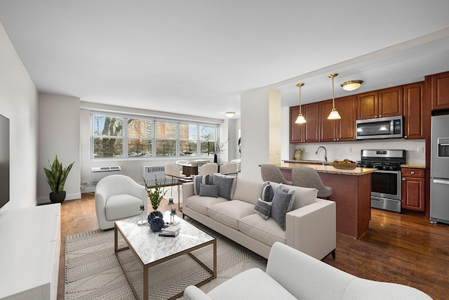 880 Boynton Ave Unit 1K, Bronx, NY 10473 - living room featuring dark wood-style flooring and radiator heating unit