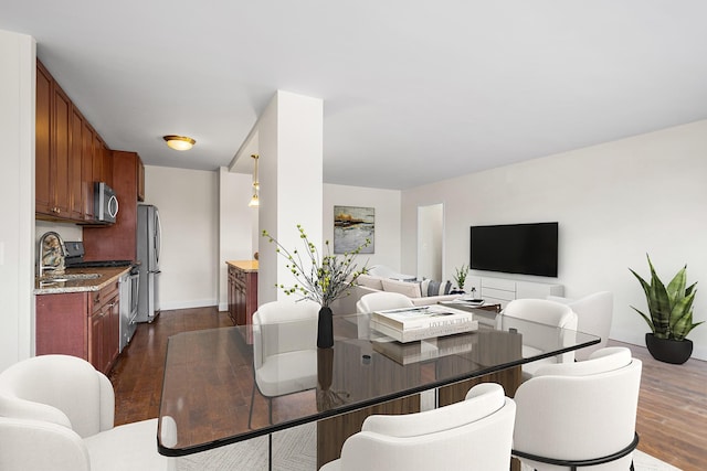 880 Boynton Ave Unit 1K, Bronx, NY 10473 - dining space featuring dark wood-style floors and baseboards