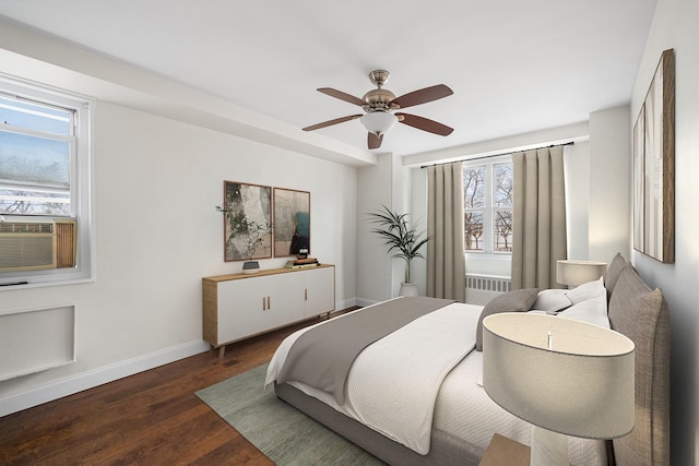 880 Boynton Ave Unit 1K, Bronx, NY 10473 - bedroom featuring radiator heating unit, multiple windows, baseboards, and wood finished floors