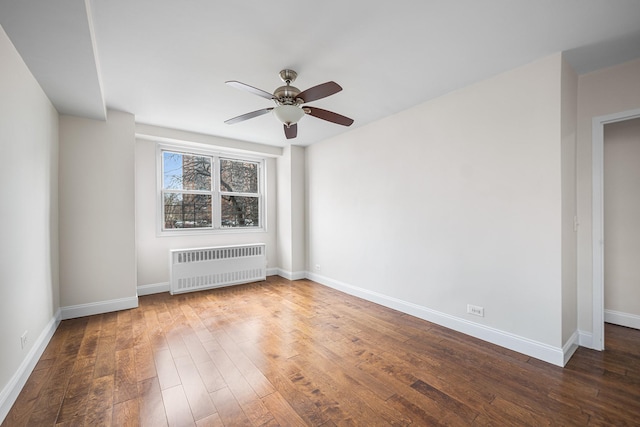 880 Boynton Ave Unit 1K, Bronx, NY 10473 - empty room with radiator heating unit, ceiling fan, wood finished floors, and baseboards