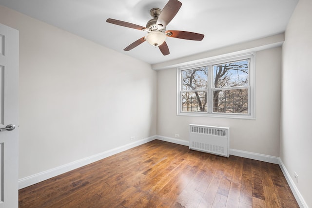 880 Boynton Ave Unit 1K, Bronx, NY 10473 - empty room with radiator heating unit, hardwood / wood-style floors, baseboards, and a ceiling fan