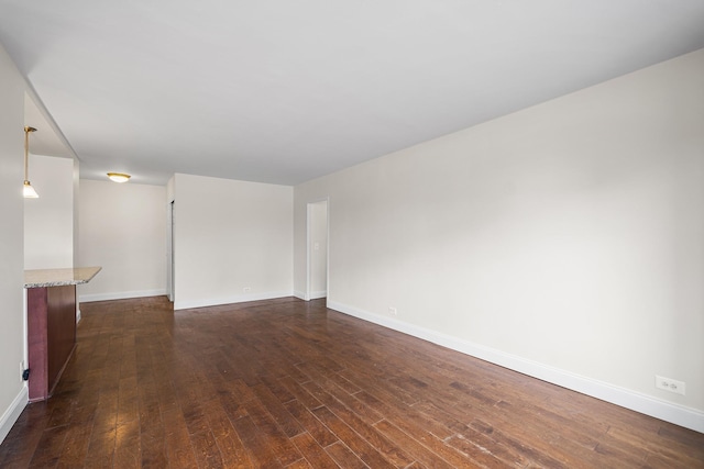 880 Boynton Ave Unit 1K, Bronx, NY 10473 - spare room featuring dark wood-style flooring and baseboards