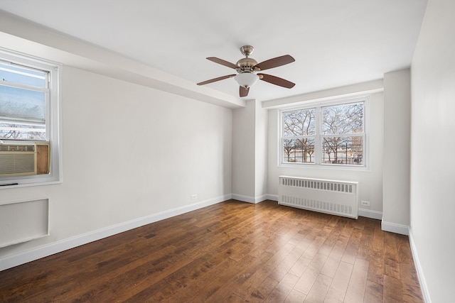 880 Boynton Ave Unit 1K, Bronx, NY 10473 - unfurnished room with radiator heating unit, plenty of natural light, hardwood / wood-style flooring, and baseboards