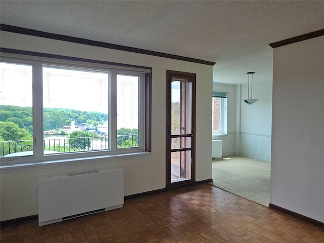 16 Rockledge Ave Unit 5B1, Ossining, NY 10562 - spare room featuring radiator, baseboards, and a textured ceiling