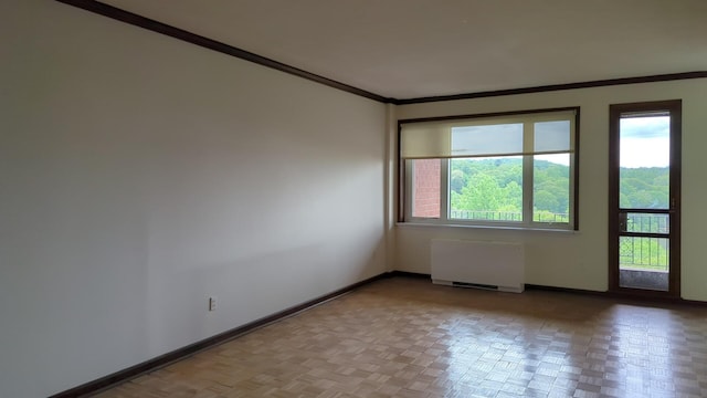 16 Rockledge Ave Unit 5B1, Ossining, NY 10562 - spare room with radiator heating unit, crown molding, and baseboards