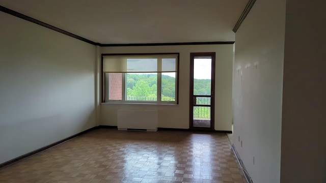 16 Rockledge Ave Unit 5B1, Ossining, NY 10562 - spare room with crown molding, radiator, and baseboards