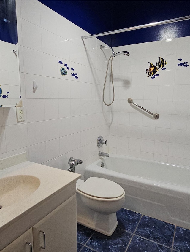 16 Rockledge Ave Unit 5B1, Ossining, NY 10562 - bathroom featuring tile walls, toilet, shower / tub combination, vanity, and marble look tiles