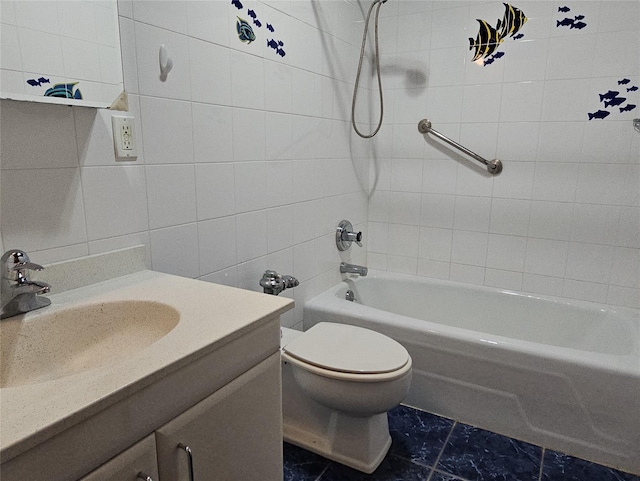 16 Rockledge Ave Unit 5B1, Ossining, NY 10562 - bathroom featuring tile walls, toilet, vanity, and shower / washtub combination