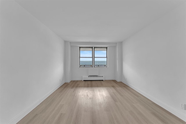 5700 Arlington Ave Unit 20K, Bronx, NY 10471 - unfurnished room with baseboard heating, light wood finished floors, and baseboards