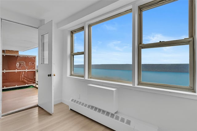 5700 Arlington Ave Unit 20K, Bronx, NY 10471 - spare room with baseboard heating, light wood-style floors, and baseboards