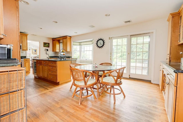 21 Maple Rd, Setauket, NY 11733 - dining space with light wood-type flooring, beverage cooler, and recessed lighting