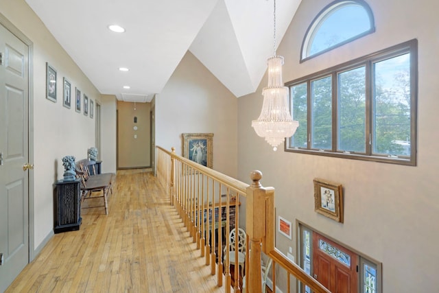 106 S Country Rd, Westhampton Beach, NY 11978 - hall with an upstairs landing, a chandelier, attic access, light wood-style floors, and recessed lighting