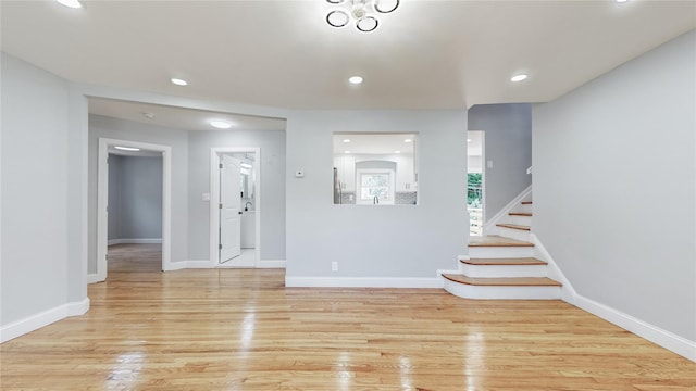 596 Terrace Pl, Baldwin, NY 11510 - foyer entrance with light wood-type flooring, stairway, recessed lighting, and baseboards