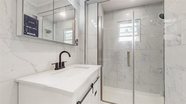 596 Terrace Pl, Baldwin, NY 11510 - bathroom featuring tile walls, vanity, and a shower stall