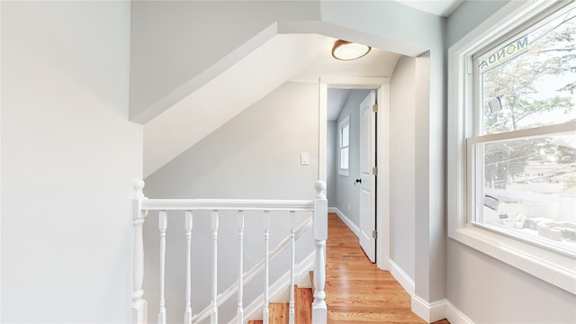 596 Terrace Pl, Baldwin, NY 11510 - hall featuring healthy amount of natural light, light wood-style floors, an upstairs landing, and baseboards