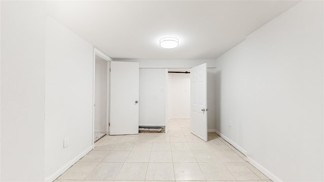 596 Terrace Pl, Baldwin, NY 11510 - unfurnished bedroom featuring baseboards
