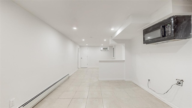 596 Terrace Pl, Baldwin, NY 11510 - finished basement featuring baseboard heating, recessed lighting, baseboards, and light tile patterned flooring