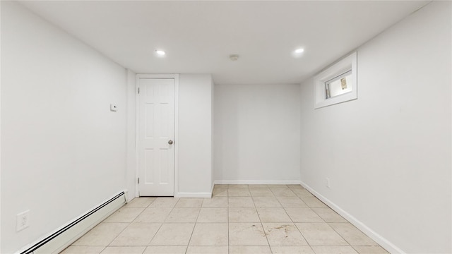 596 Terrace Pl, Baldwin, NY 11510 - spare room featuring a baseboard heating unit, recessed lighting, light tile patterned floors, and baseboards
