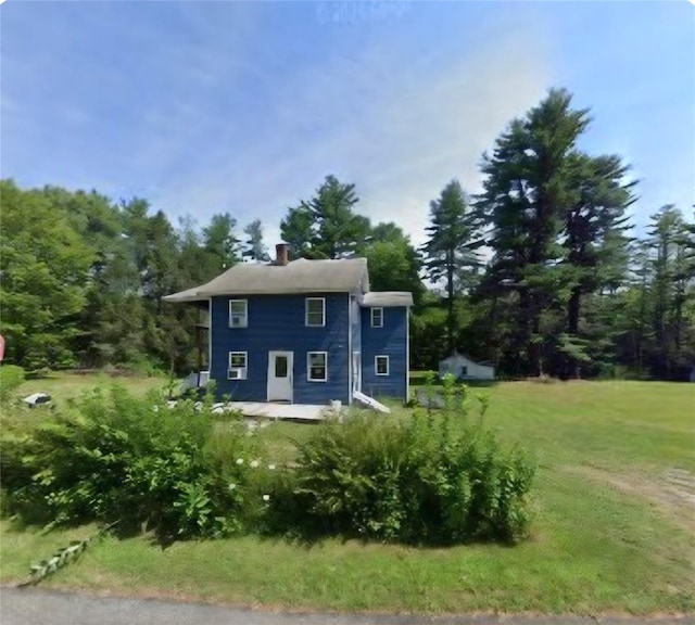 750 Irish Cape Rd, Ellenville, NY 12428 - rear view of property with a chimney and a lawn