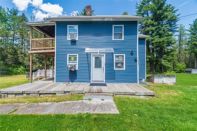 750 Irish Cape Rd, Ellenville, NY 12428 - rear view of property featuring a yard, a deck, a chimney, and a balcony