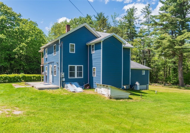 750 Irish Cape Rd, Ellenville, NY 12428 - rear view of house featuring a chimney and a yard