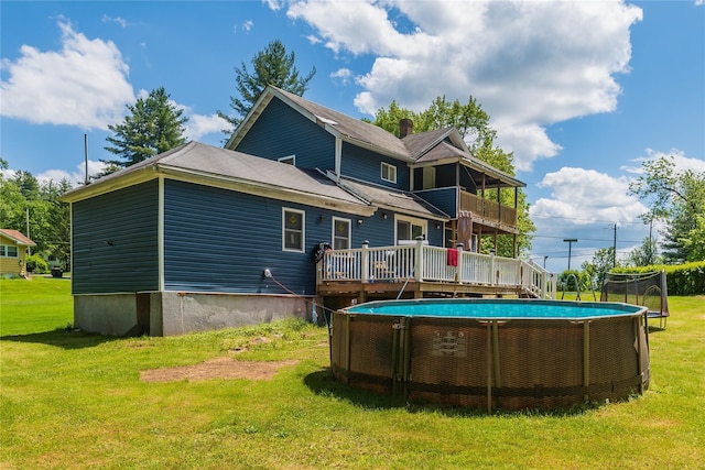 750 Irish Cape Rd, Ellenville, NY 12428 - rear view of house featuring a lawn, a deck, and a balcony