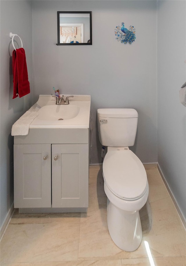750 Irish Cape Rd, Ellenville, NY 12428 - bathroom featuring toilet, baseboards, and vanity