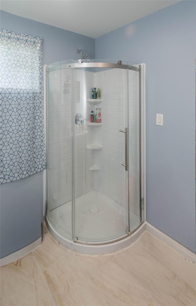 750 Irish Cape Rd, Ellenville, NY 12428 - bathroom with a stall shower, baseboards, and marble look tiles