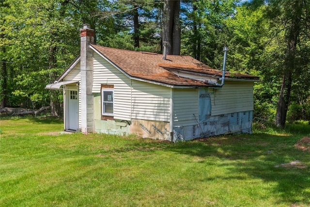 750 Irish Cape Rd, Ellenville, NY 12428 - view of home's exterior with a lawn, a chimney, and a shingled roof