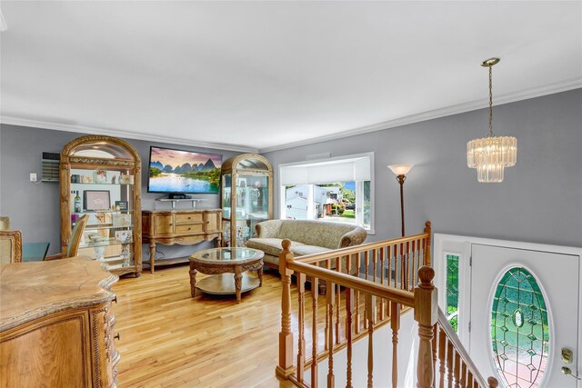 10 Charter Ct, Dix Hills, NY 11746 - living room with crown molding, light wood finished floors, and a chandelier