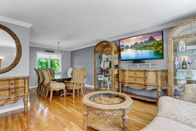 10 Charter Ct, Dix Hills, NY 11746 - living room with light wood-style floors, ornamental molding, baseboards, and a chandelier