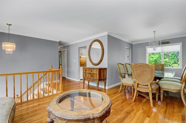 10 Charter Ct, Dix Hills, NY 11746 - dining space featuring a chandelier, wood-type flooring, crown molding, and baseboards
