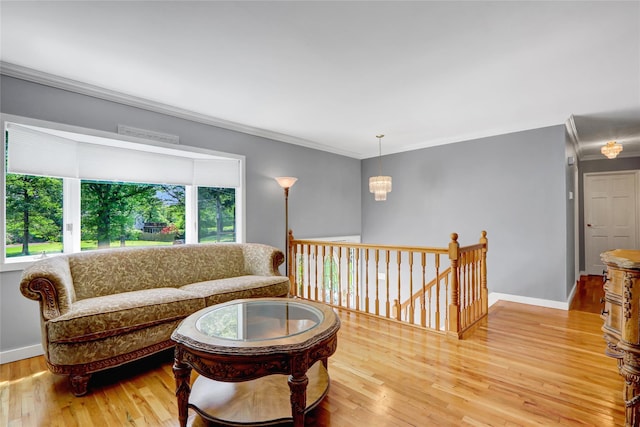 10 Charter Ct, Dix Hills, NY 11746 - living room with crown molding, wood finished floors, baseboards, and a chandelier