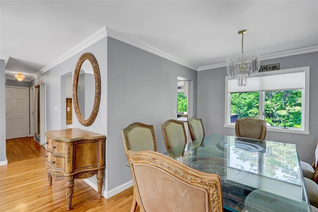 10 Charter Ct, Dix Hills, NY 11746 - dining space featuring a chandelier, light wood-style floors, ornamental molding, and baseboards