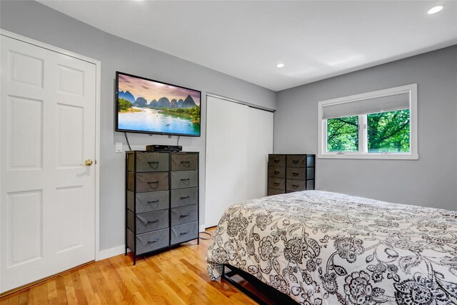 10 Charter Ct, Dix Hills, NY 11746 - bedroom with light wood-style flooring, recessed lighting, a closet, and baseboards