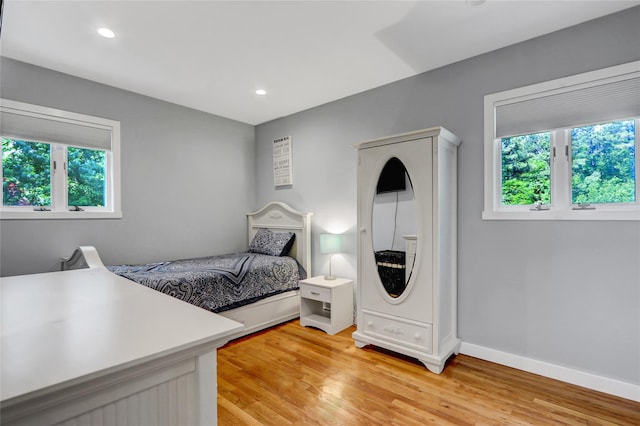 10 Charter Ct, Dix Hills, NY 11746 - bedroom with multiple windows, light wood-style flooring, baseboards, and recessed lighting