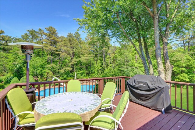 10 Charter Ct, Dix Hills, NY 11746 - wooden deck with outdoor dining area, an outdoor pool, and grilling area