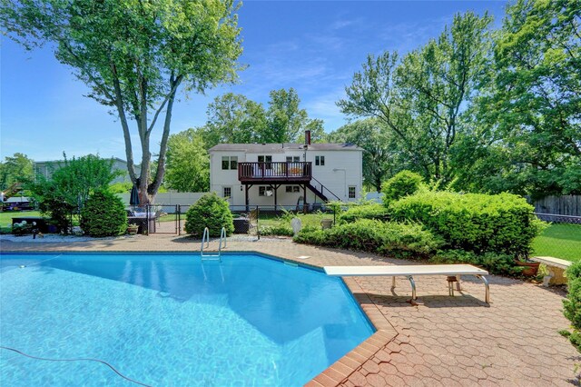 10 Charter Ct, Dix Hills, NY 11746 - view of swimming pool featuring a wooden deck, stairs, and a diving board