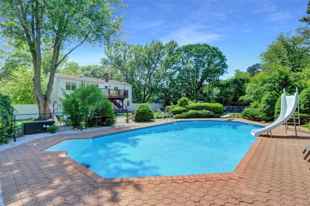 10 Charter Ct, Dix Hills, NY 11746 - view of pool featuring a water slide, stairs, and a diving board