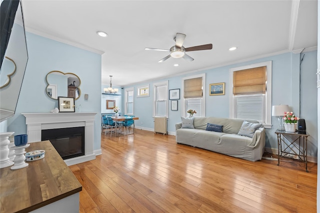 70-27 Olcott St, Forest Hills, NY 11375 - living room featuring radiator, ceiling fan, crown molding, recessed lighting, and light wood finished floors