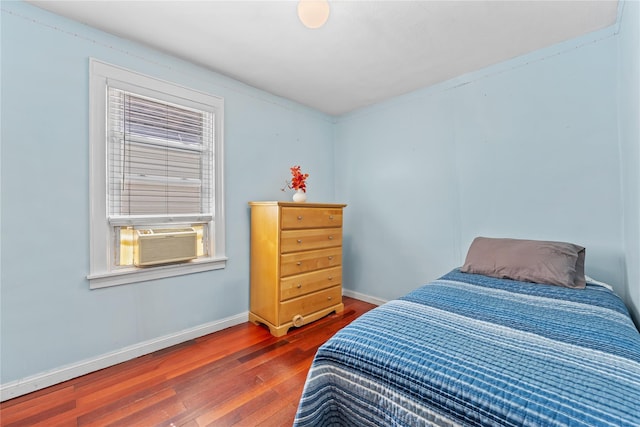 70-27 Olcott St, Forest Hills, NY 11375 - bedroom featuring wood-type flooring and cooling unit