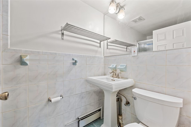 70-27 Olcott St, Forest Hills, NY 11375 - bathroom with baseboard heating, an enclosed shower, and tile walls