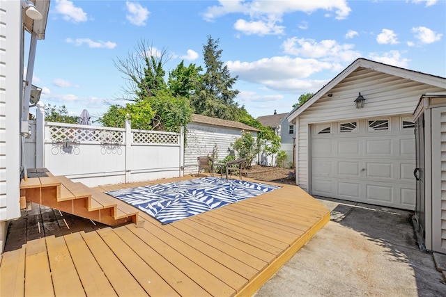 70-27 Olcott St, Forest Hills, NY 11375 - wooden terrace featuring an outbuilding and a detached garage