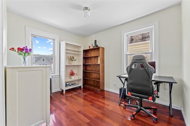 70-27 Olcott St, Forest Hills, NY 11375 - home office featuring dark wood-type flooring and baseboards