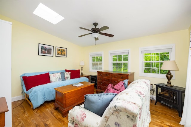 90 Fieldstone Blvd, Wappingers Falls, NY 12590 - bedroom featuring wood finished floors, vaulted ceiling, a skylight, ceiling fan, and baseboards