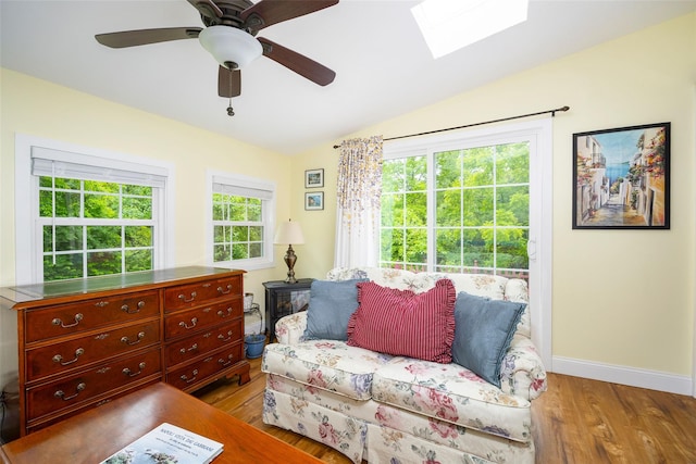 90 Fieldstone Blvd, Wappingers Falls, NY 12590 - living area with vaulted ceiling, wood finished floors, a skylight, baseboards, and a ceiling fan