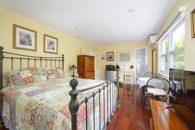 90 Fieldstone Blvd, Wappingers Falls, NY 12590 - bedroom with a wall mounted AC, dark wood finished floors, and recessed lighting
